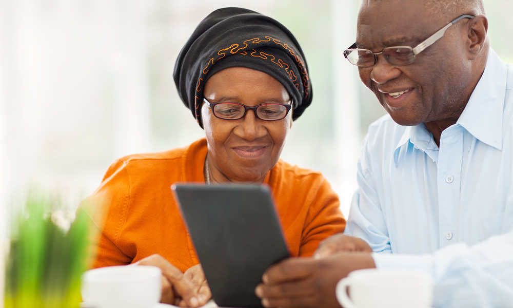 Elderly african couple using tablet computer Elderly african couple using tablet computer